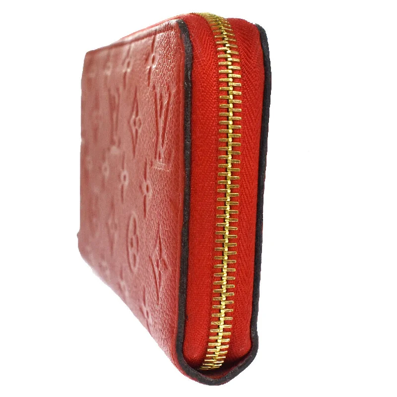 Louis Vuitton crossbody bags in a bold red color for a statementLouis Vuitton Long Zippy Wallet