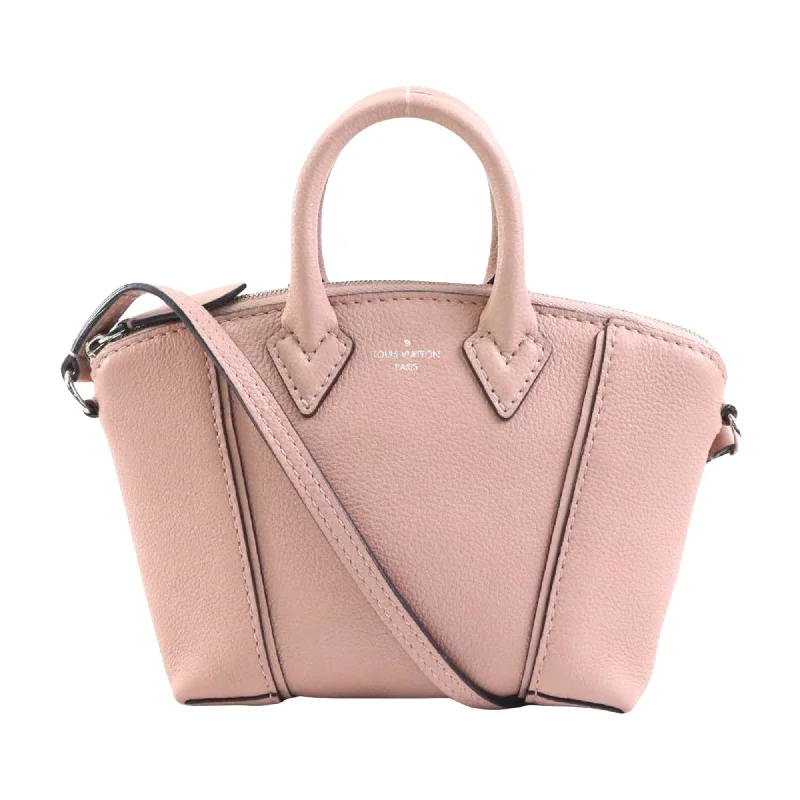 Ladies Louis Vuitton Petite Malle bags in a pastel color for a soft lookLOUIS VUITTON Lockit Handbag