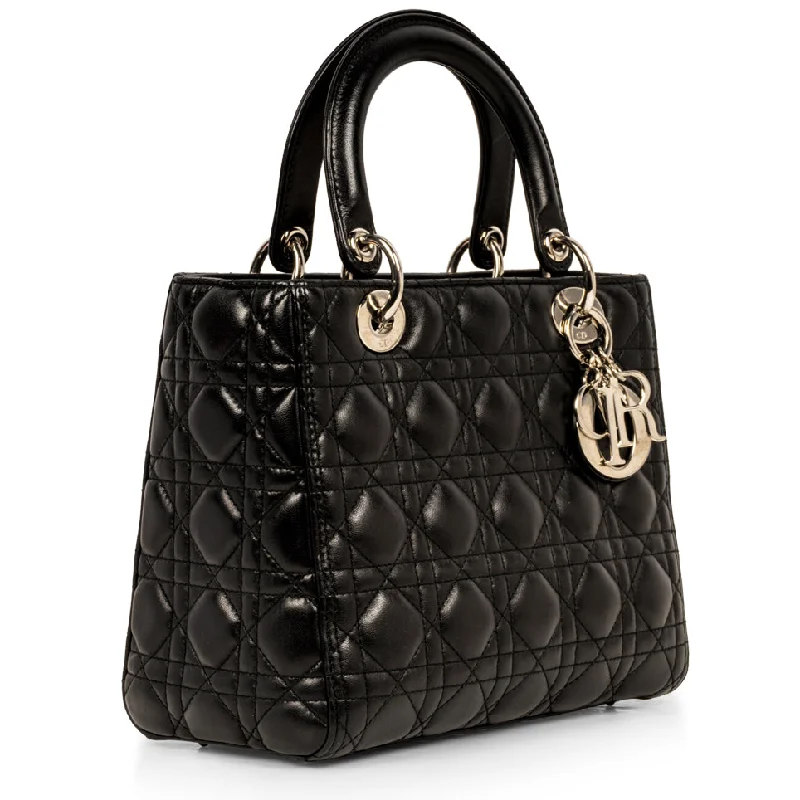 Christian Dior Saddle bags with a studded trim for a bold lookLady Dior Medium